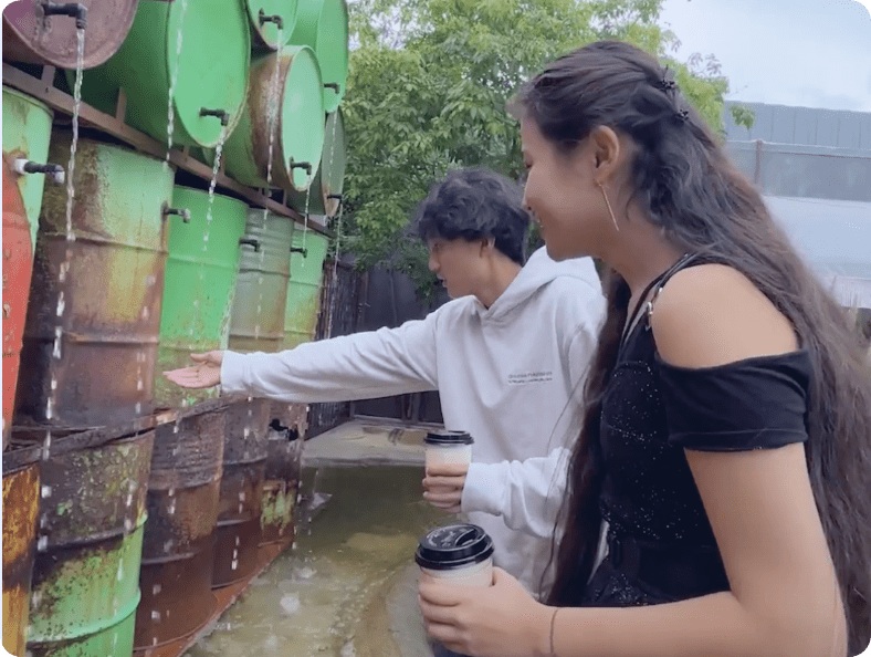Boy and girl looking at barrels